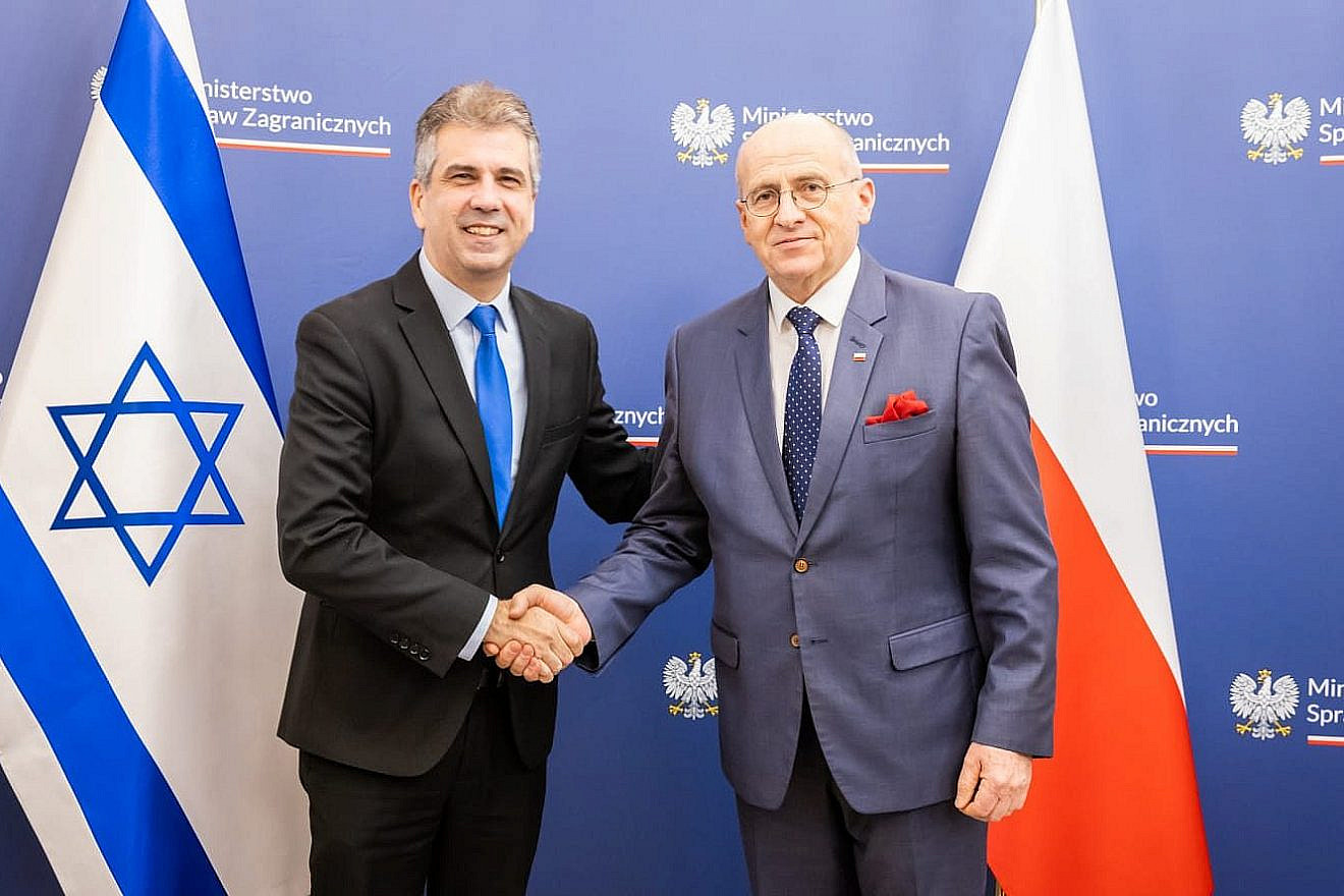 Israeli Foreign Minister Eli Cohen (left) meets with Polish Foreign Minister Zbigniew Rau in Warsaw, March 22, 2023. Credit: Israeli Foreign Ministry via Twitter.