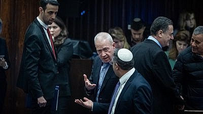 Defense Minister Yoav Gallant (center) speaks with National Security Minister Itamar Ben-Gvir after a vote at the Knesset in Jerusalem, Feb. 15, 2023. Photo by Yonatan Sindel/Flash90.