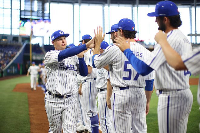 Joc Pederson (left) of Team Israel congratulates teammates after beating Nicaragua in a come-from-behind win at the World Baseball Classic on March 12, 2023. Credit: Courtesy of Major League Baseball.