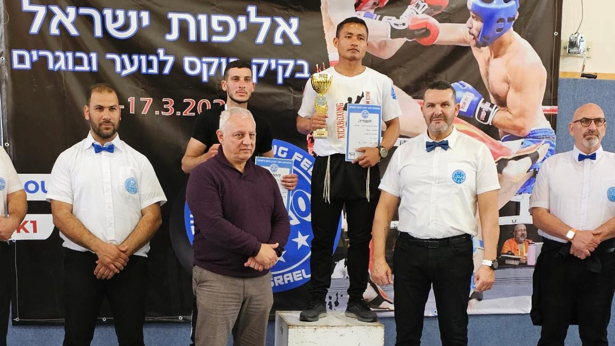 Obed Hrangchal stands in the champion's spot at the national tournament in Kfar Yasif, the Western Galilee, March 17, 2023. Courtesy.