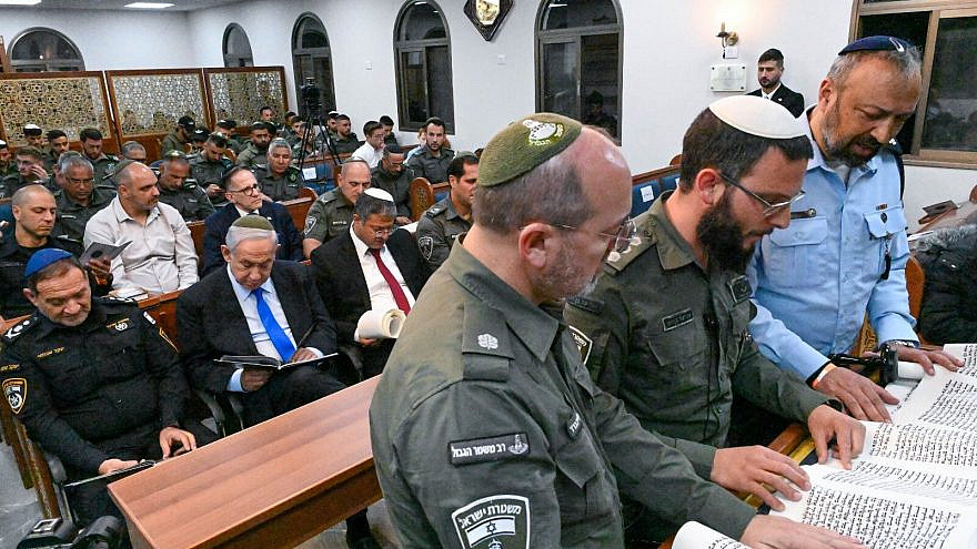 Prime Minister Benjamin Netanyahu and National Security Minister Itamar Ben-Gvir (both seated) attend a Scroll of Esther reading for Purim at a synagogue at the Beit Horon Border Police base, March 6, 2023. Photo by Kobi Gideon/GPO.
