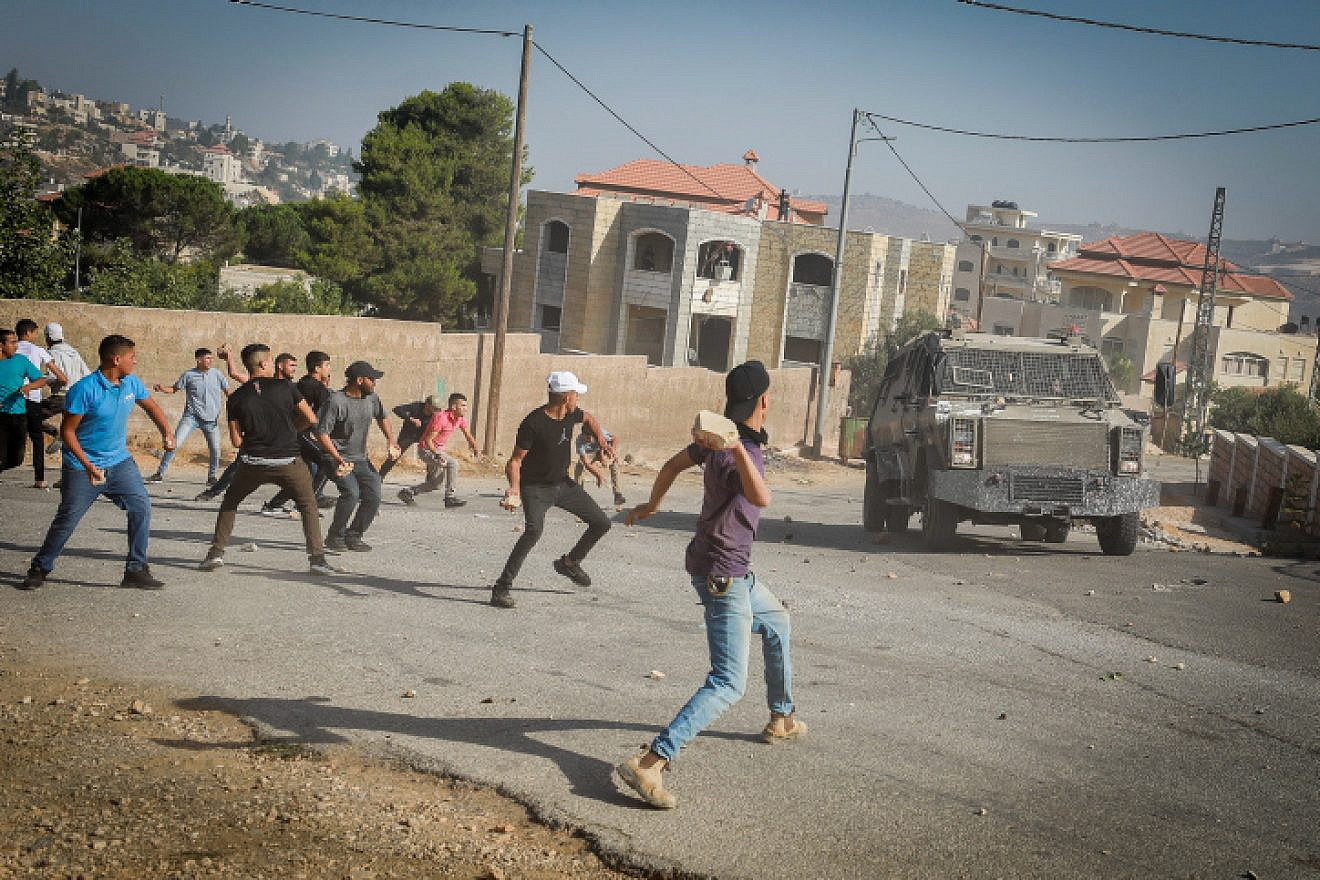 Palestinians attack Israeli security personnel during a counterterror in Silwad, northeast of Ramallah, on Aug. 31, 2022. Photo by Flash90.