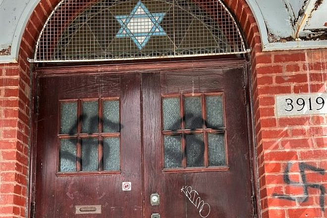 Swastikas were discovered on the front doors and adjacent brick facade of the Bagg Street Shul in Montreal, Canada, March 2023. Source: Twitter/Michal Cotler-Wunsch.