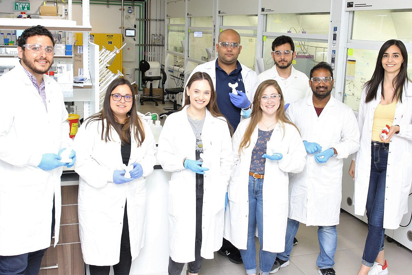 Technion–Israel Institute of Technology Professor Shady Farah (standing, far left) and members of his research team in Haifa, Israel. Credit: Courtesy of the Technion Israel-Institute of Technology.