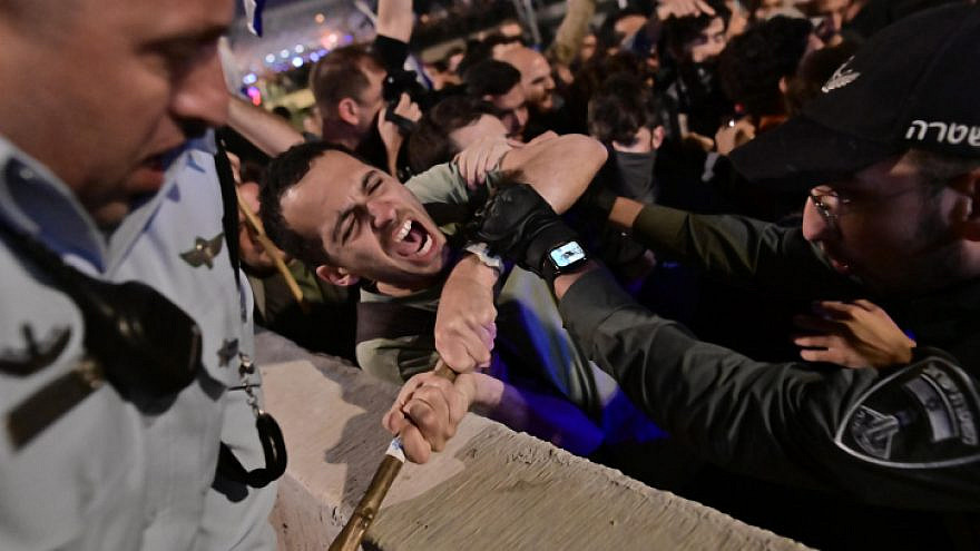 Israelis protesting in Tel Aviv against the government's judicial reform plans grapple with police, March 4, 2023. Photo by Tomer Neuberg/Flash90.