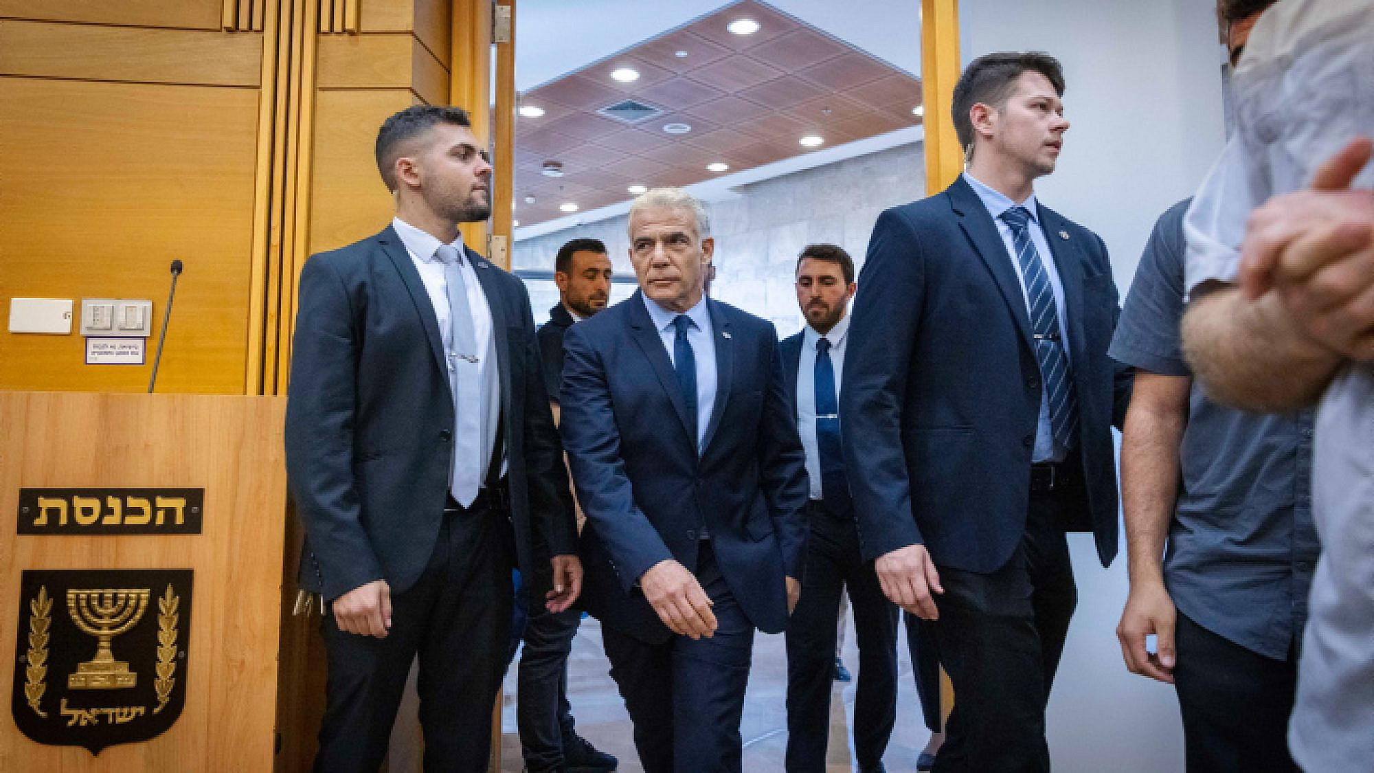 Then-Prime Minister Yair Lapid enters a meeting of his Yesh Atid Party at the Knesset, Dec. 5, 2022. Photo by Olivier Fitoussi/Flash90.