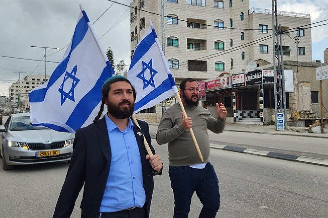 Religious Zionism Knesset member Tzvi Sukkot marches through Huwara, outside Nablus, March 26, 2023. Credit: Courtesy.
