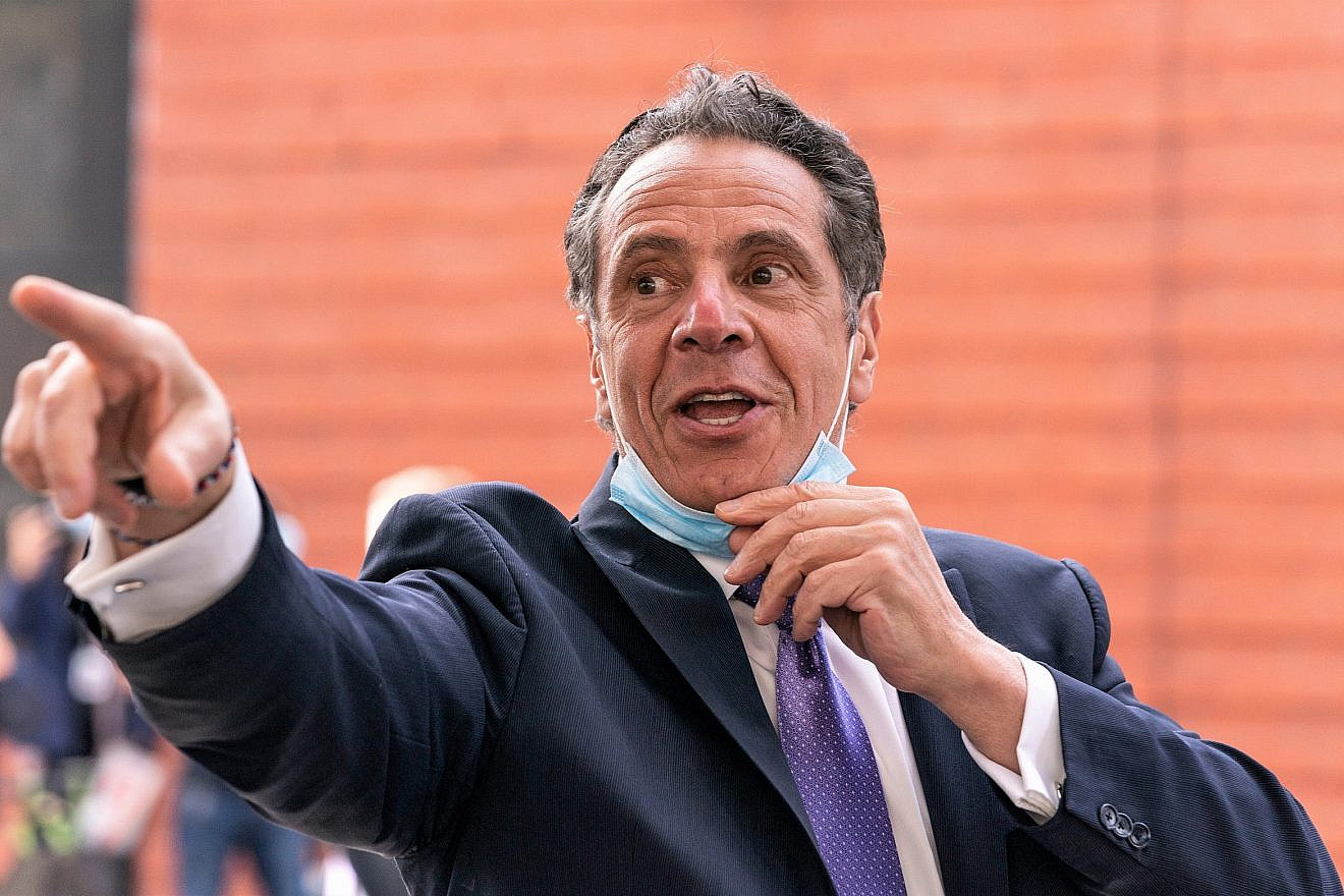 New York Gov. Andrew Cuomo leaves New Settlement Community Center after announcing a partnership with SOMOS Community Care to provide COVID-19 vaccines, March 26, 2021. Credit: Lev Radin/Shutterstock.