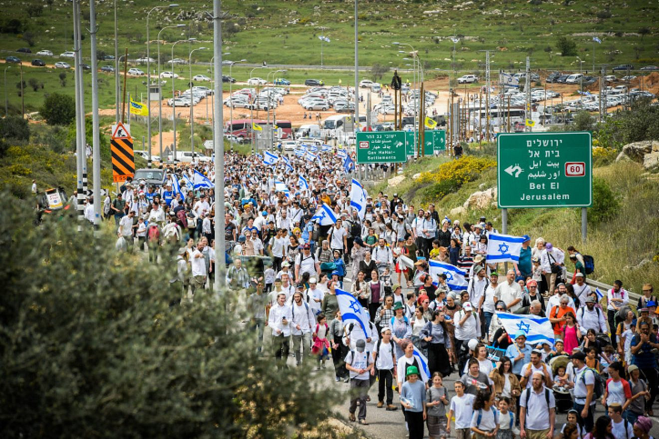 Israelis march to the Evyatar outpost in Samaria, April 10, 2023. Photo by Sraya Diamant/Flash90.