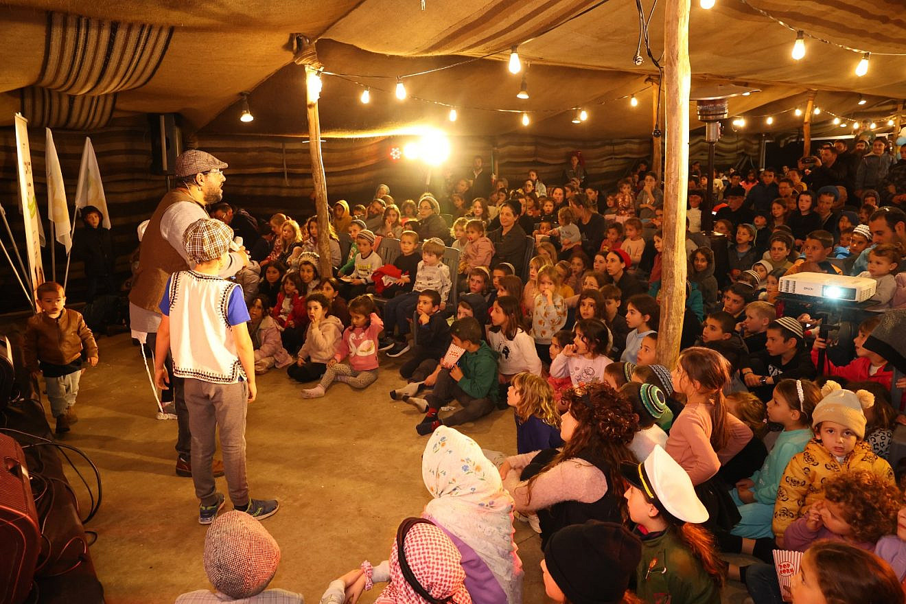 Children watch a skit at Kfar Etzion in Judea on the founding of the community, April 13, 2023. Photo by Yehoshua Menashe.