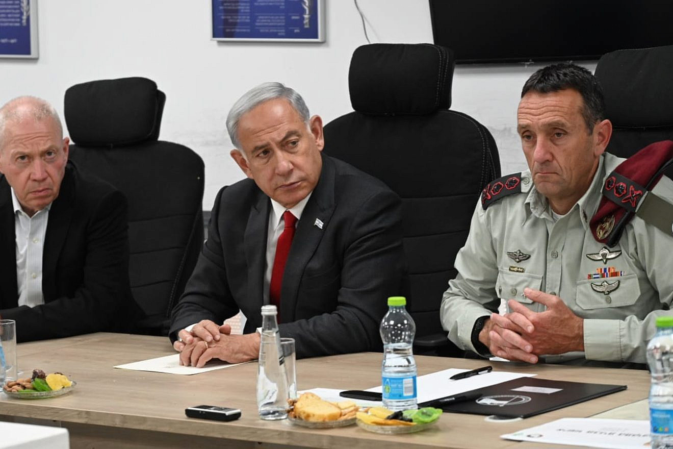 Israel's Prime Minister Benjamin Netanyahu holds a security assessment at Camp Dayan, north of Tel Aviv, after a barrage of rockets were fired from the Gaza Strip. Next to him are Israeli Defense Minister Yoav Gallant (left) and IDF Chief of Staff Herzi Halevy, May 2, 2023. Photo by Haim Zach/GPO.