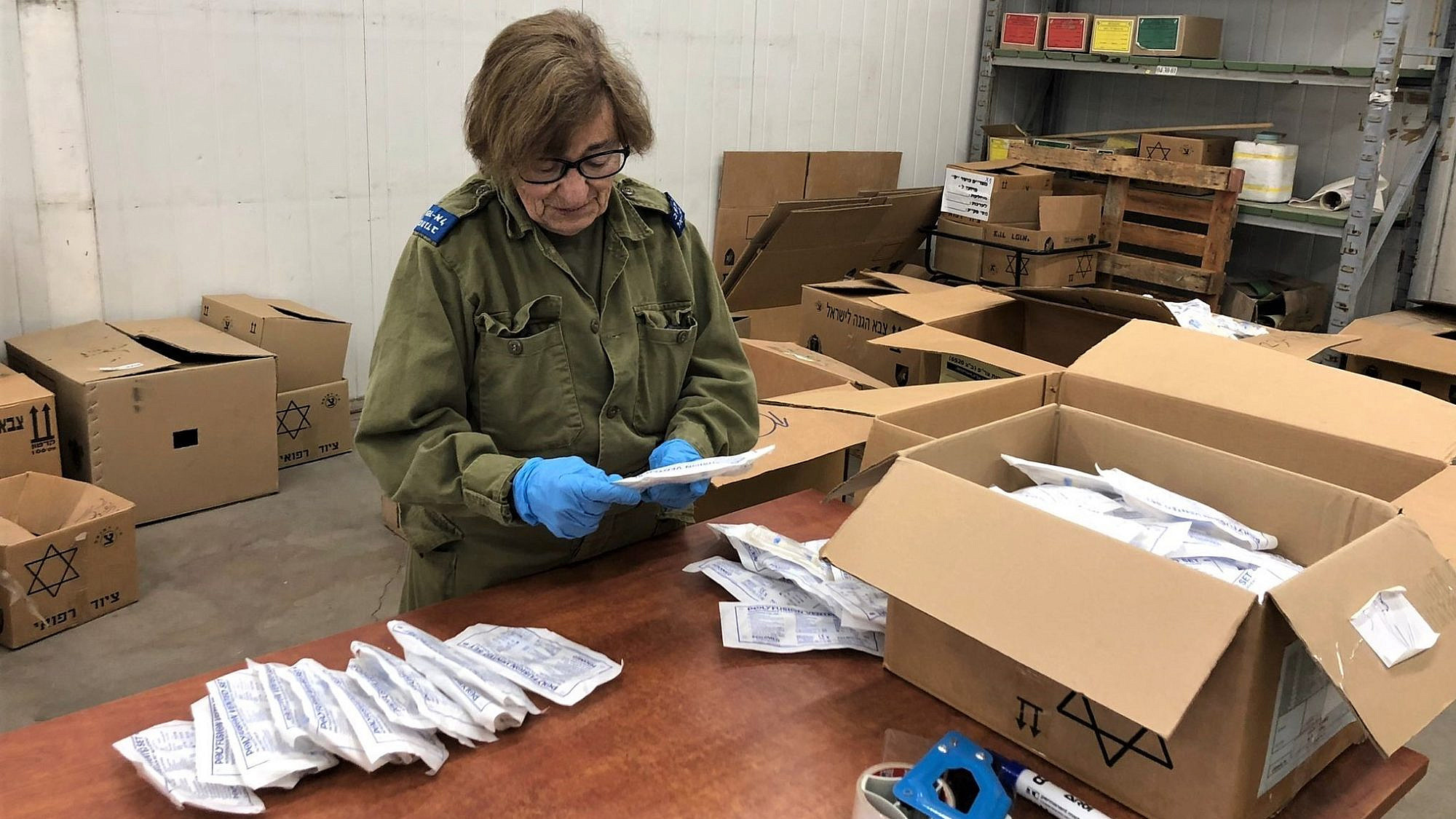 Camilla Maas of Rochester, N.Y., checks medical supplies on an Israel Defense Forces base as part of Sar-El, or the “Volunteers for Israel” program. Credit: Courtesy.