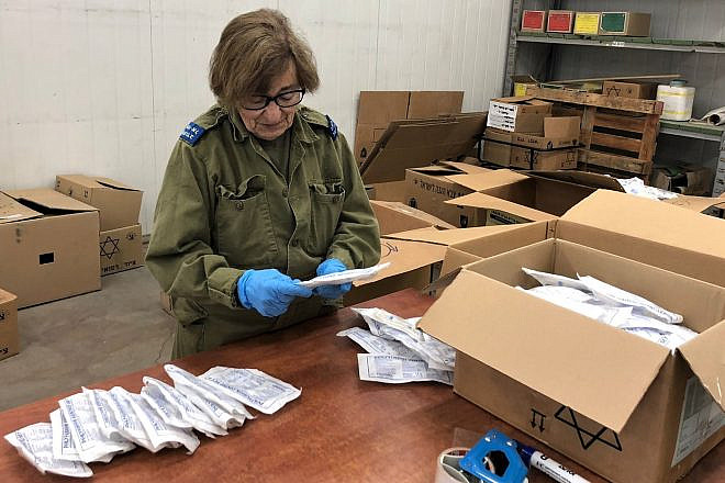 Camilla Maas of Rochester, N.Y., checks medical supplies on an Israel Defense Forces base as part of Sar-El, or the “Volunteers for Israel” program. Credit: Courtesy.