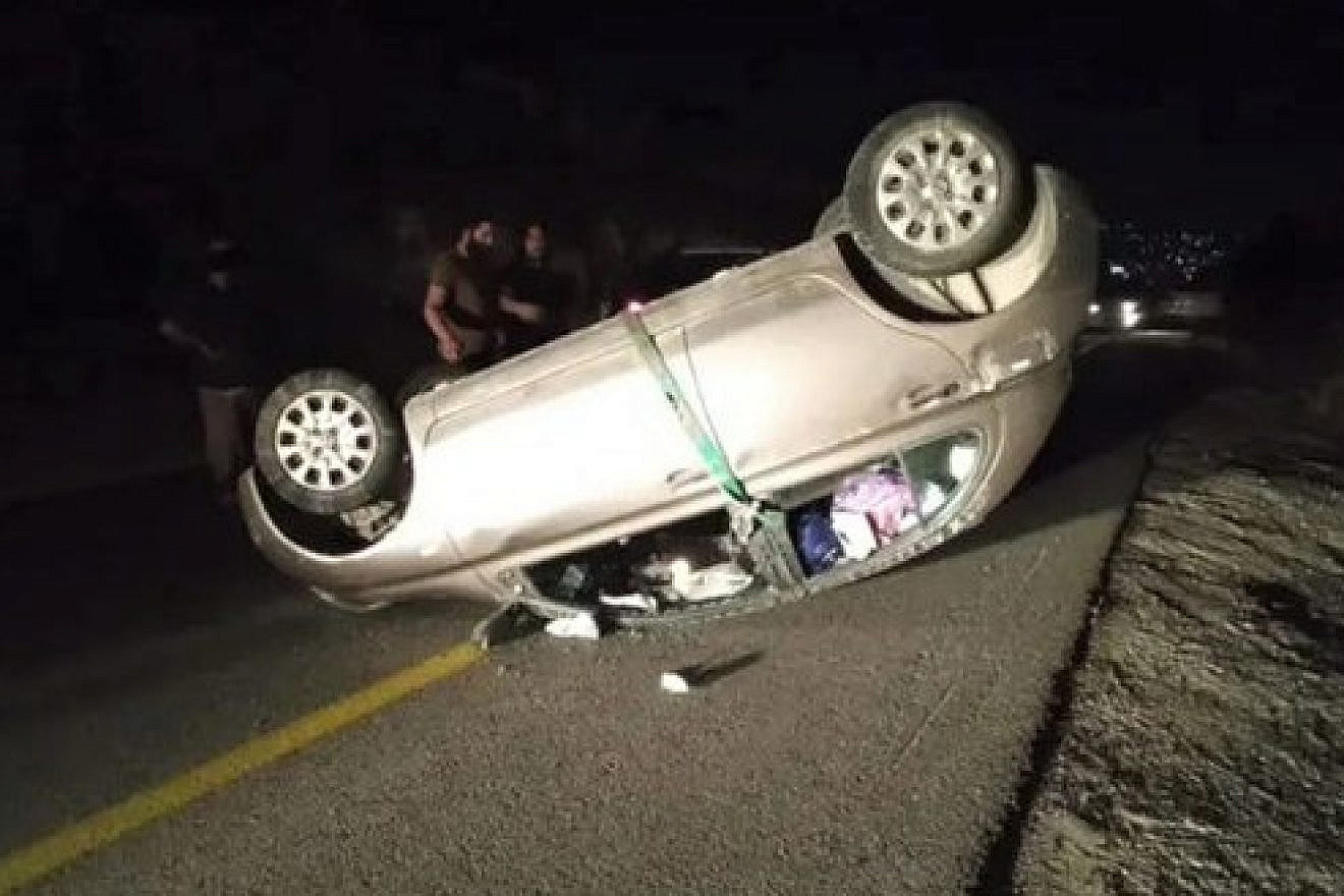 A car driven by a pregnant woman in Samaria flipped over after it was hit by Palestinians throwing rocks in Samaria. Source: Twitter.