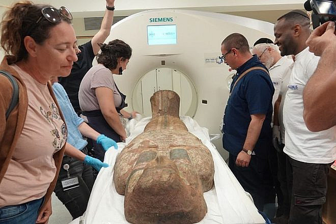Staff from the Israel Museum and Shaare Zedek Medical Center run a CT scan on a 2,000-year-old Egyptian coffin lid, May 19, 2023. Credit: Shaare Zedek Medical Center.