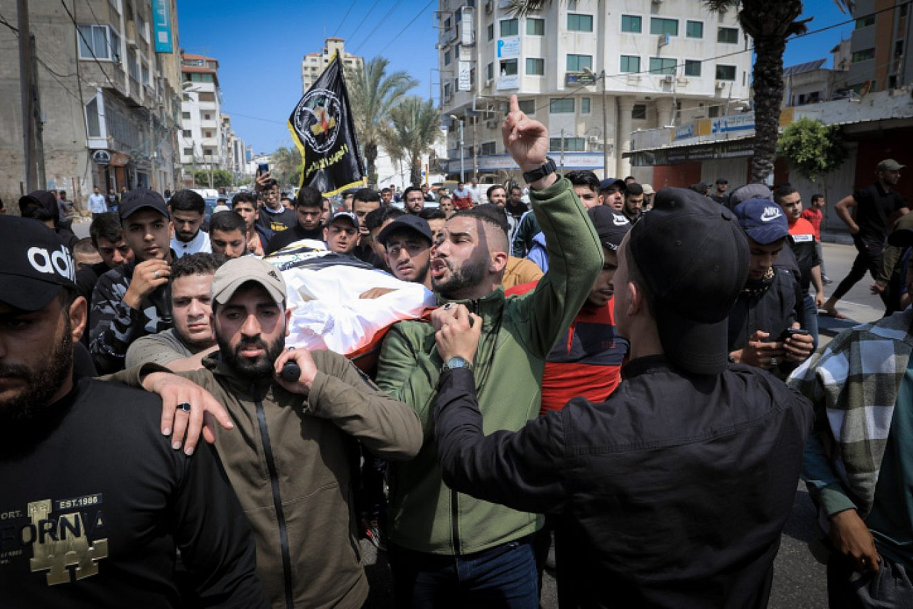 Mourners bid farewell to Palestinian-Russian doctor Jamal Khaswan and his son as their bodies are transported from the mortuary to their homes ahead of their burial in Gaza City on May 9, 2023, following early morning Israeli air strikes on the Palestinian territory. The air raids killed three Islamic Jihad militant group leaders and several others, according to officials in the Hamas-controlled territory. Photo by Atia Mohammed/Flash90