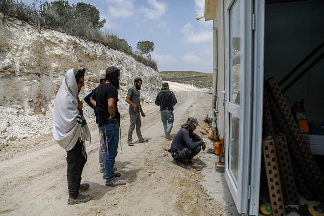 Jewish men work at the Homesh outpost in northern Samaria, May 29, 2023. Credit: Flash90.