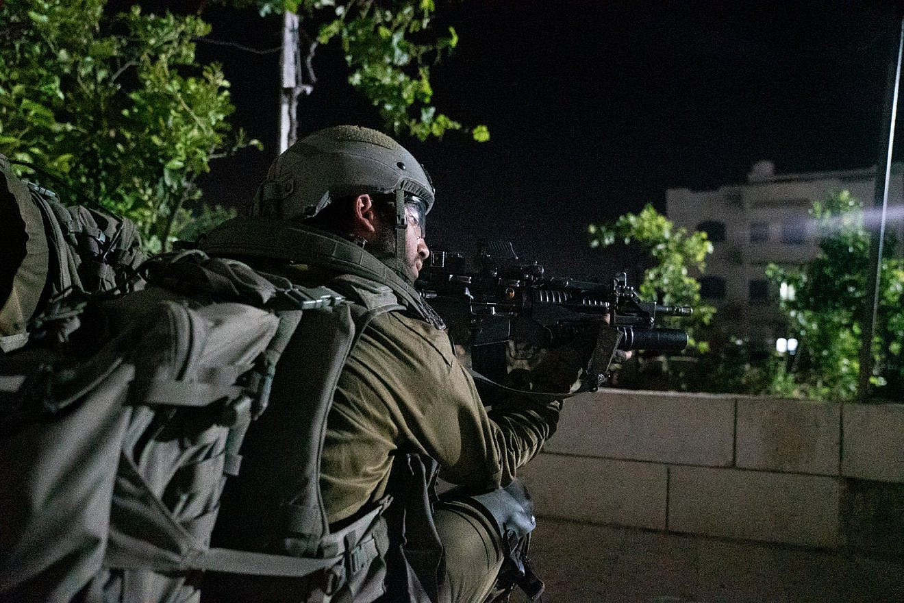 An Israeli soldier during a nighttime counterterror operation in Judea and Samaria. Credit: IDF.