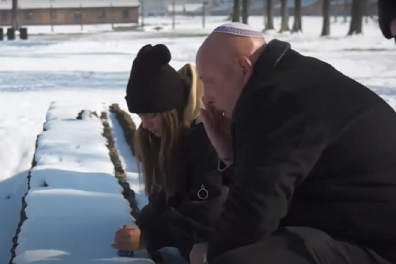 Noa Kirel and her father, Amir, at Auschwitz in Poland in 2019. Source: YouTube.