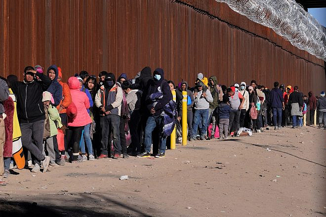 Thousands of migrants seek asylum at the U.S.-Mexico border, Dec. 21, 2022. Credit: Ruben2533/Shutterstock.