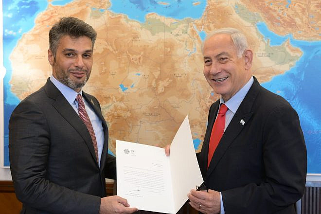 Israeli Prime Minister Benjamin Netanyahu, right, receives a formal invitation to attend COP28 in Dubai from UAE Ambassador to Israel Mohamed Mahmoud Al Khaja on May 22, 2023 in Jerusalem. Photo by Amos Ben-Gershom (GPO)