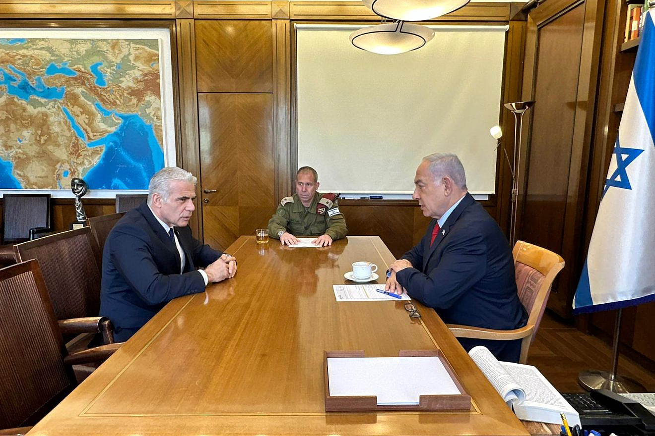 Israeli Prime Minister Benjamin Netanyahu updates opposition leader Yair Lapid (left) on "Operation Shield and Arrow," May 10, 2023. Credit: Courtesy.
