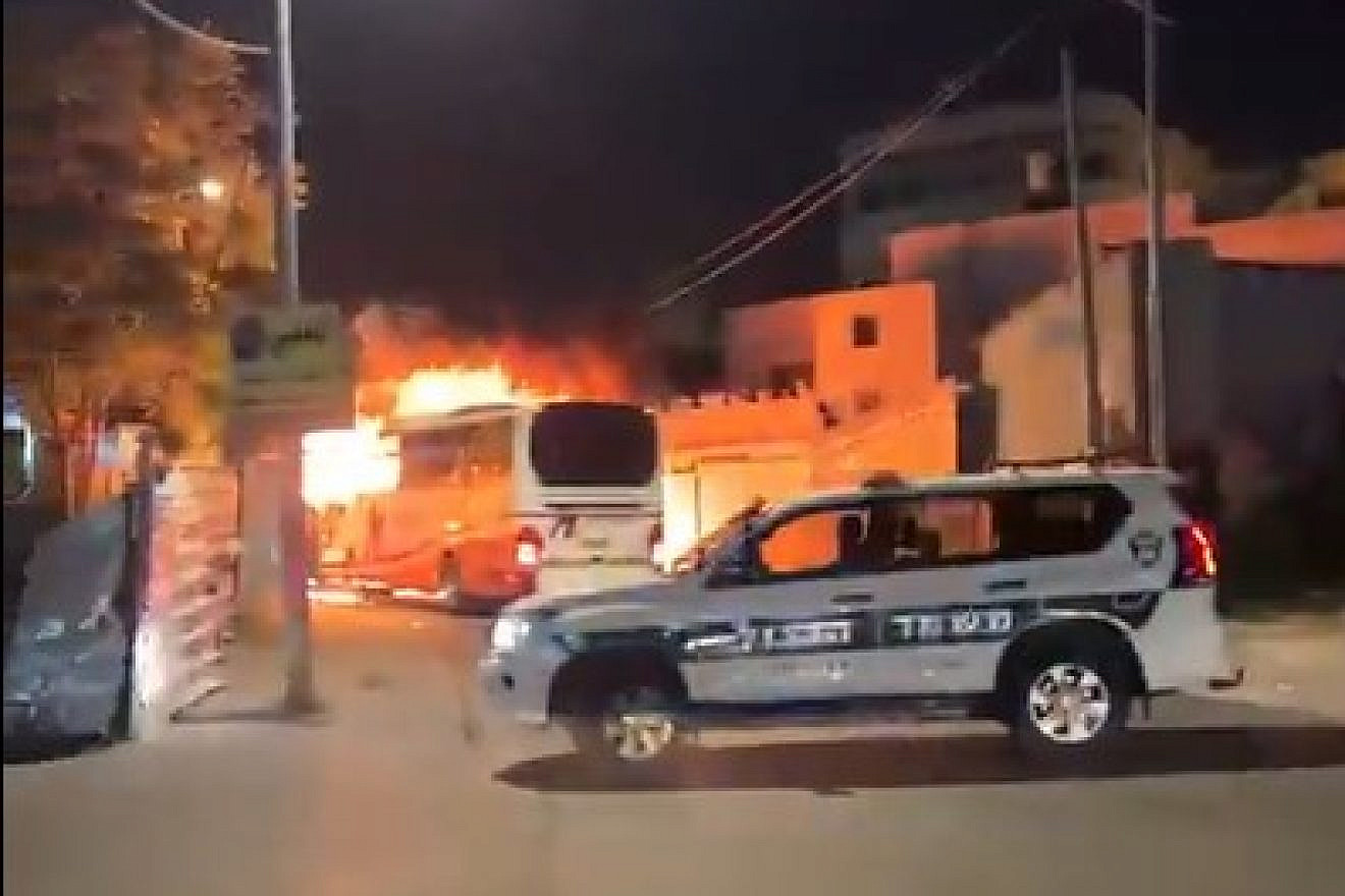 The private bus on fire after being targeted by local Arabs in eastern Jerusalem on May 9, 2023. Source: Twitter