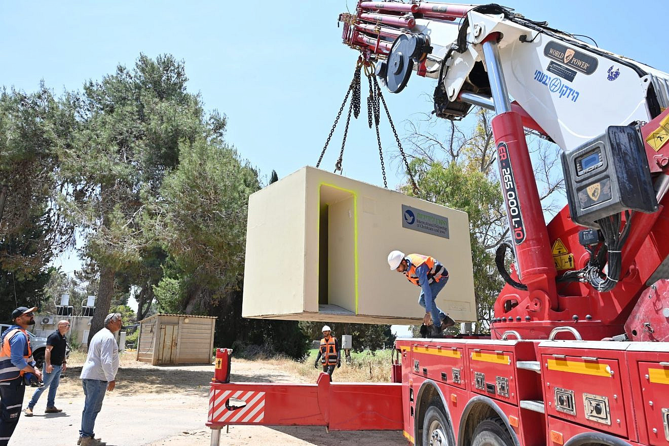 A bomb shelter donated by the International Fellowship of Christians and Jews is unloaded in Ashkelon, May 10, 2023. Photo by Yossi Zeliger/IFCJ.