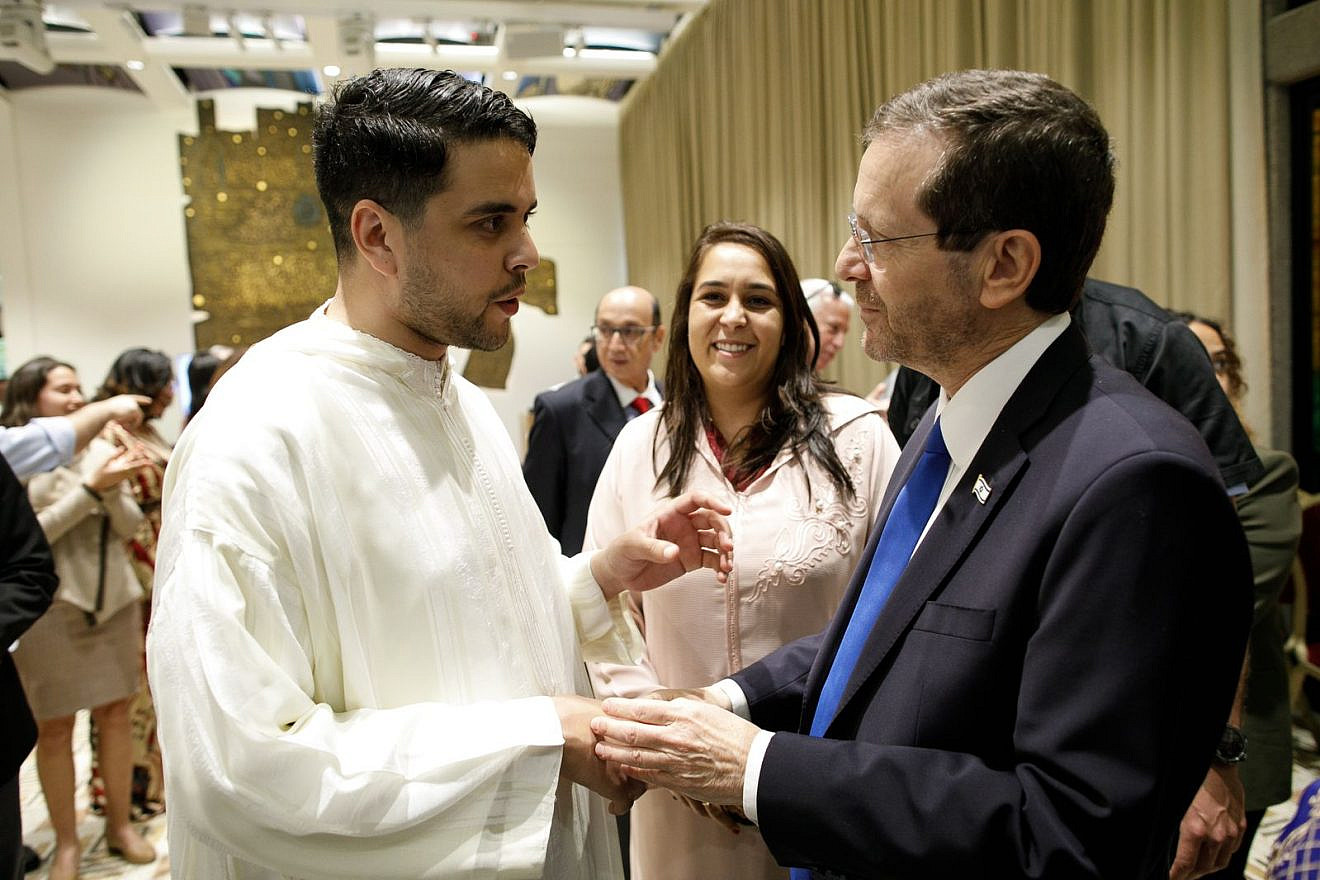 Youssef Elazhari, director of the Morocco branch of the nonprofit Sharaka, meets with Israeli President Isaac Herzog. Credit: Courtesy.