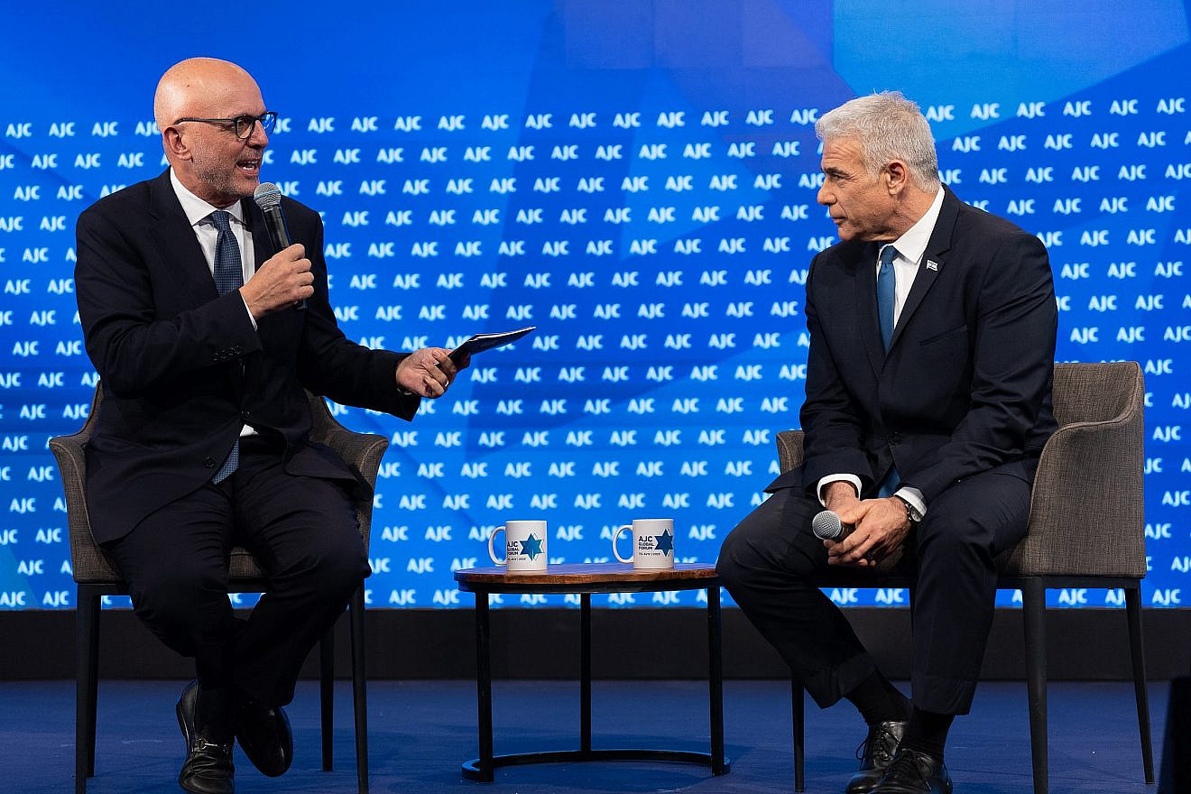 American Jewish Committee CEO Ted Deutch (left) in conversation with opposition leader Yair Lapid at the AJC Global Forum in Tel Aviv, June 11, 2023. Photo by Yair Meyuhas/AJC.