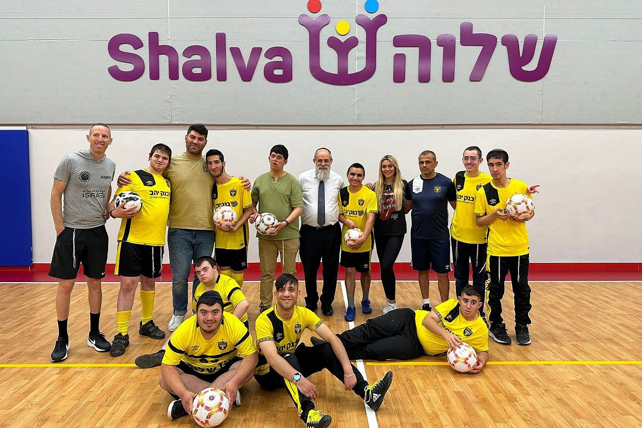 Israeli-American sports broadcaster and social-media influencer Emily Austin with kids and coaches participating in soccer camp at the Shalva Center. At left is former professional basketball player and current coach Tamir Goodman. Third from left is retired Israeli Olympic judoka Ori Sasson. Credit: Courtesy.