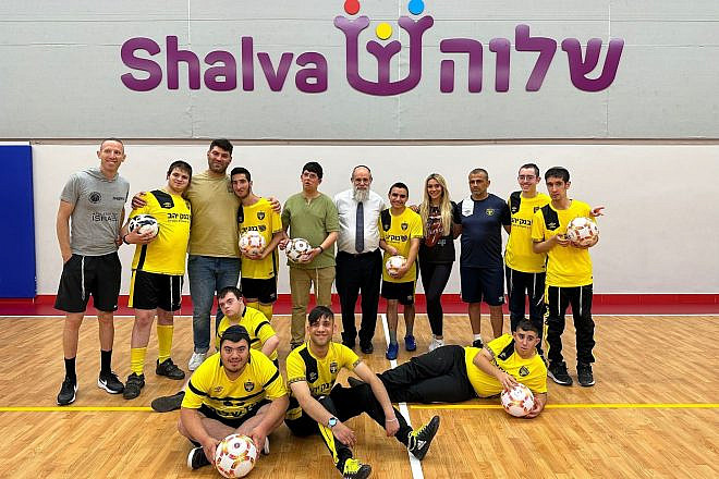 Israeli-American sports broadcaster and social-media influencer Emily Austin with kids and coaches participating in soccer camp at the Shalva Center. At left is former professional basketball player and current coach Tamir Goodman. Third from left is retired Israeli Olympic judoka Ori Sasson. Credit: Courtesy.