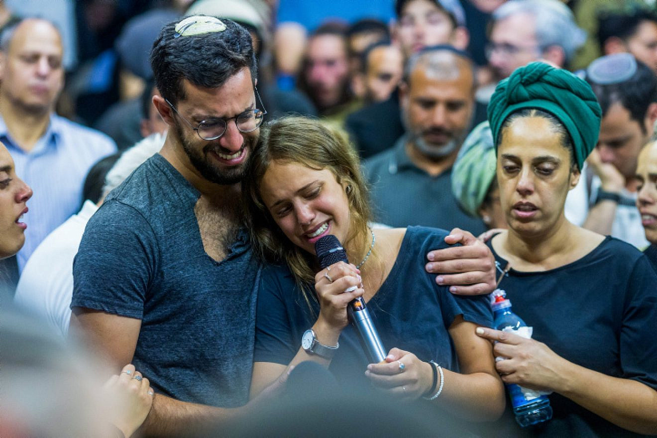 Friends and family attend the funeral in Moshav Yesodot of 21-year-old Harel Masood, who was killed in a terror attack near the near the Jewish community of Eli, June 20, 2023. Photo by Liron Moldovan/Flash90.