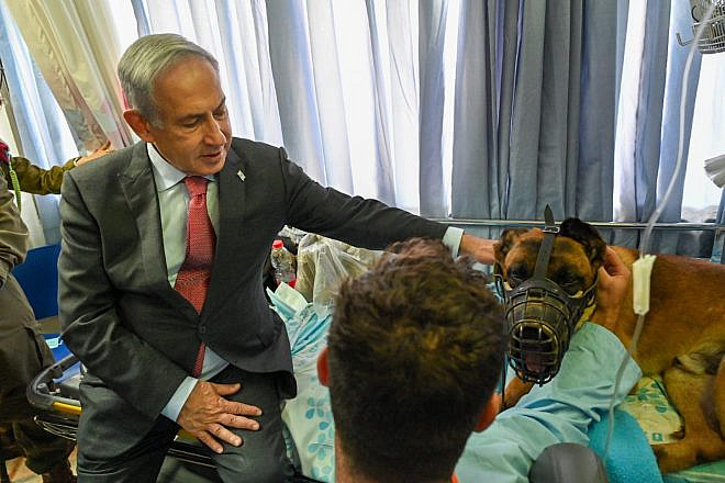 Israeli Prime Minister Benjamin Netanyahu visits soldiers and a K-9 unit, injured during an IDF raid of Jenin at Haifa's Rambam Medical Center on June 19, 2023. Photo by Kobi Gideon/GPO.