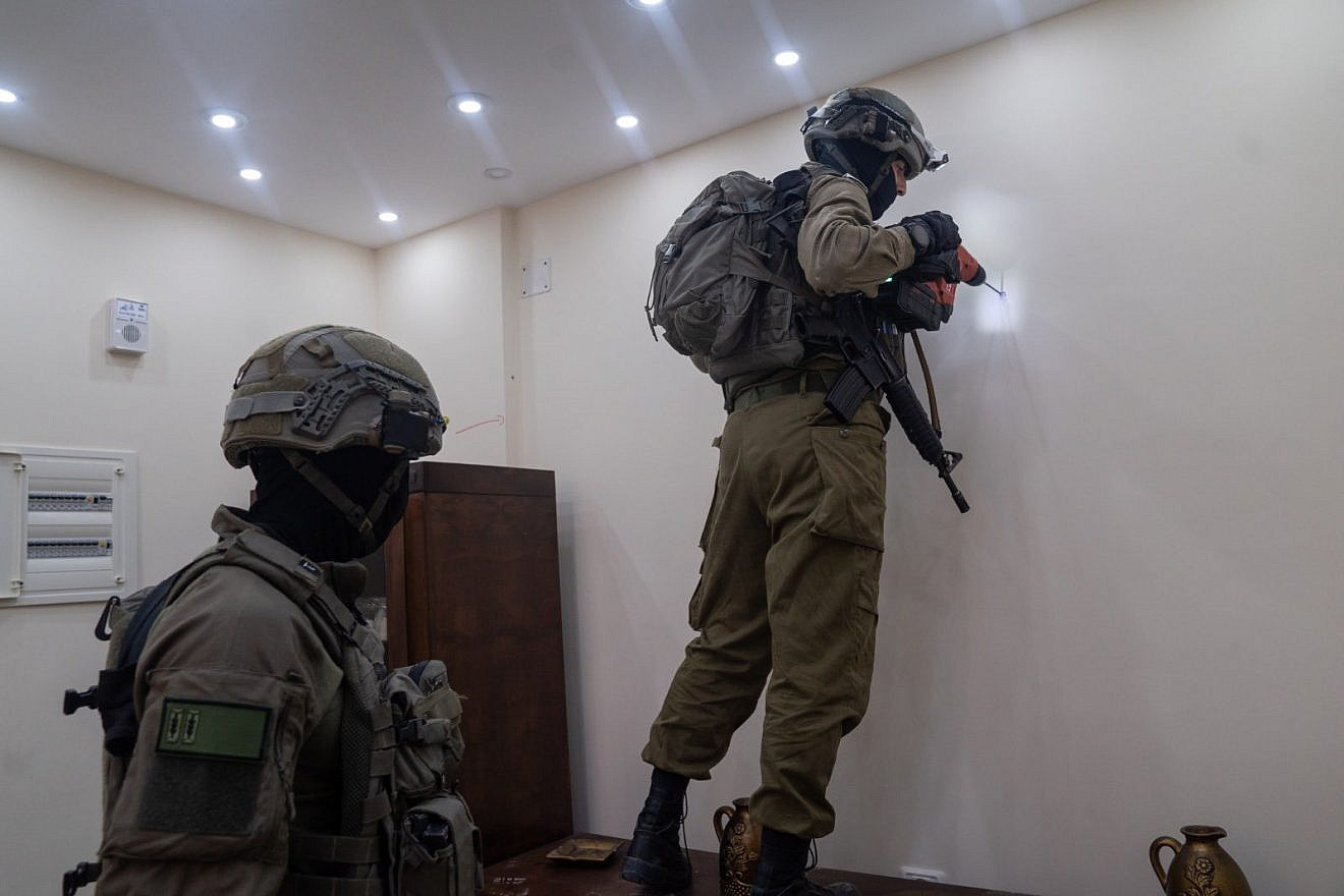 Israeli soldiers map the home in Nablus of Muad Masri, one of the Hamas terrorists who murdered three members of the Dee family, June 13, 2023. Credit: IDF.