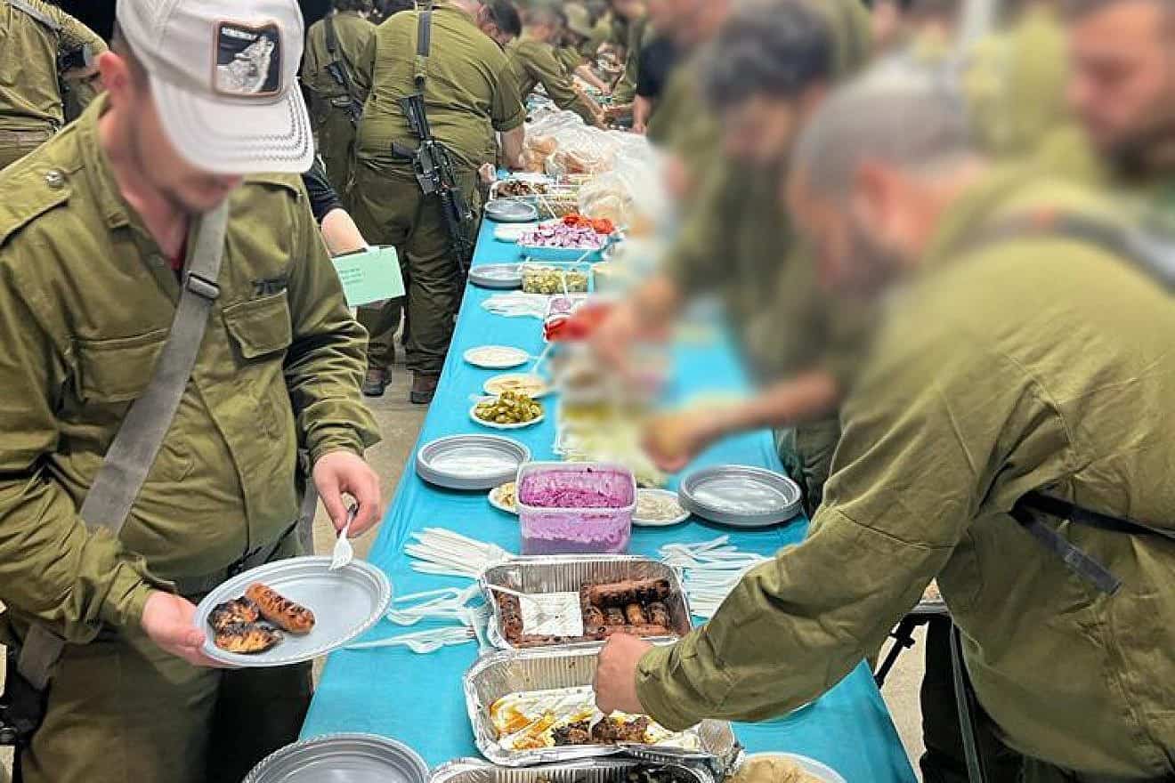 Soldiers dig in at a Grilling for IDF shindig. Photo: Courtesy.