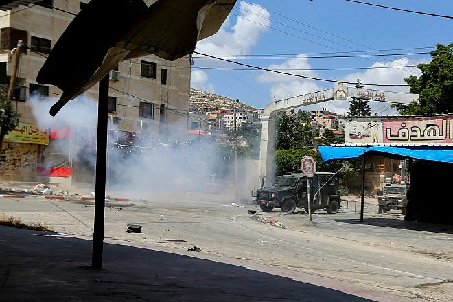 Israeli military vehicles seen during clashes between Israeli security forces and Palestinians in the West Bank city of Jenin, on June 19, 2023.  Photo by Nasser Ishtayeh/Flash90.