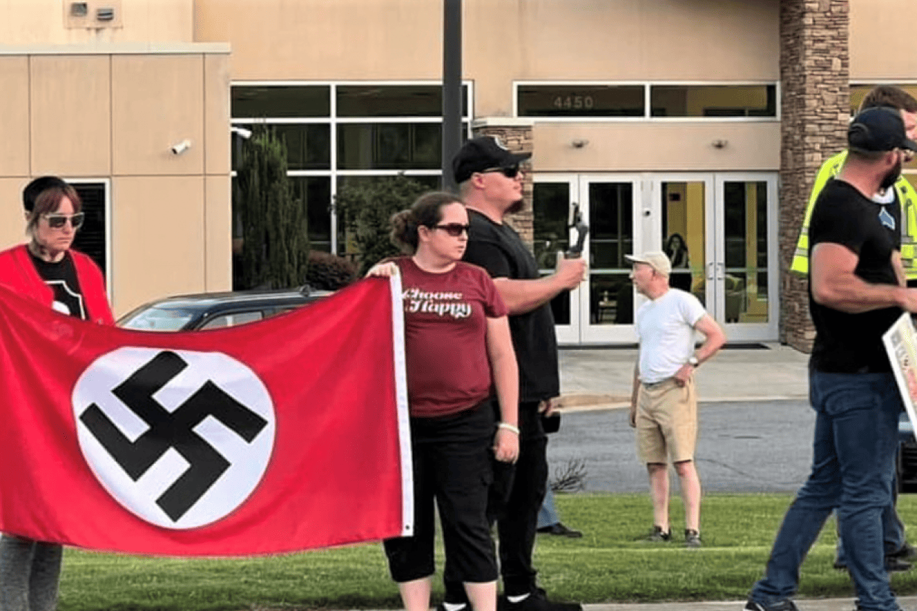 Protesters, including those belonging to neo-Nazi groups, hold swastika flags outside a synagogue in Georgia. Credit: Combat Antisemitism Movement.