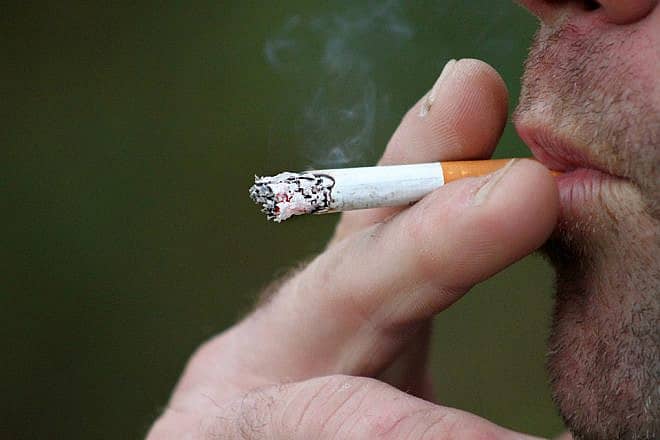 Man smoking a cigarette. Credit: Pixabay.