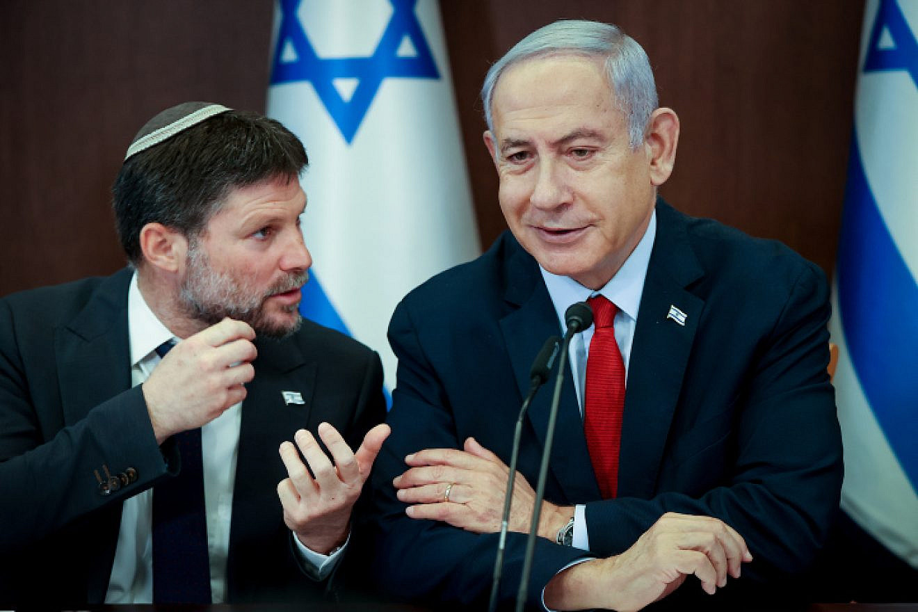 Israeli Finance Minister Bezalel Smotrich speaks with Prime Minister Benjamin Netanyahu during a Cabinet meeting in Jerusalem, June 18, 2023. Photo by Amit Shabi/POOL.