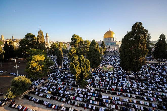 Muslims pray near the Al-Aqsa mosque on the Temple Mount during the Eid al-Adha holiday, June 28, 2023. Photo by Jamal Awad/Flash90.