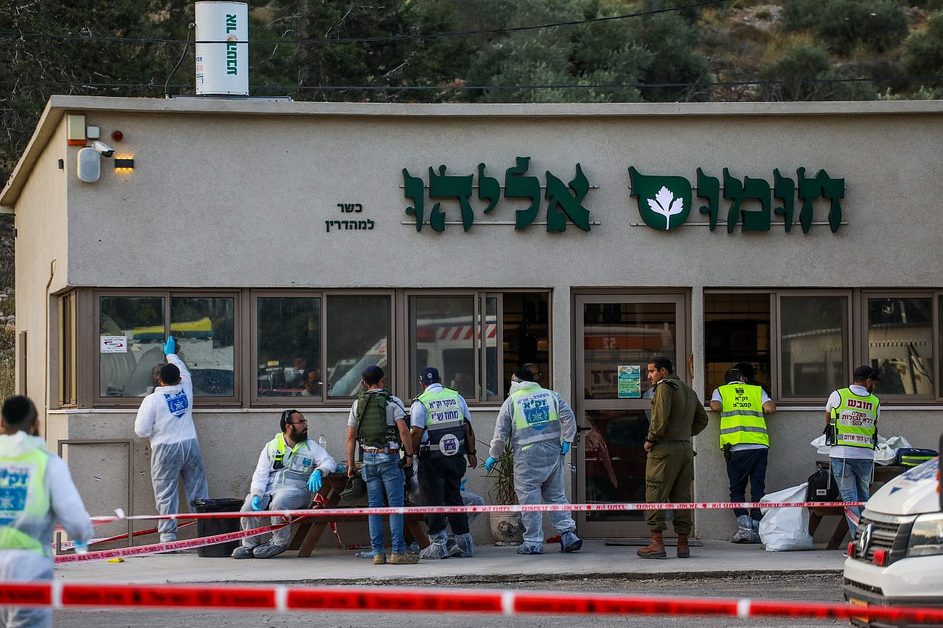 Israeli security personnel and ZAKA rescue and recovery organization workers at the scene of a deadly shooting attack near the Jewish community of Eli in Samaria, June 20, 2023. Credit: Flash90.