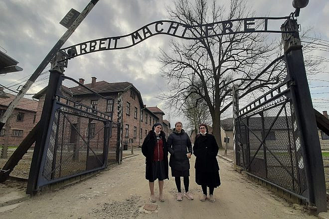 At the entrance to Auschwitz: "Triumph of the Spirit" director Miriam Cohen is flanked by producers Chani Kopilowitz (left) and Yuti Neiman. Photo: Courtesy of Triumph of the Spirit.