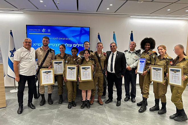 The IDF soldiers with their certificates of appreciation at the office of Aliyah and Integration Minister Ofir Sofer on June 12, 2023. Credit: Aliyah and Integration Ministry.