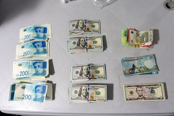 Police seized this cash from a money-laundering network, June 6, 2023. Credit: Police Spokesperson via TPS.