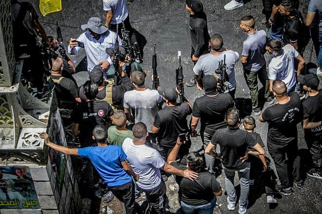 Armed Palestinians march after an Israeli military operation, in the West Bank city of Jenin on July 5, 2023. Photo by Nasser Ishtayeh/Flash90.