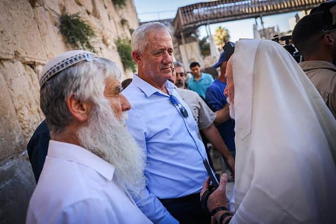 National Unity Party Chairman Benny Gantz (center) attends a prayer session held by anti-reform activists at the Western Wall in Jerusalem, July 23, 2023. Photo by Chaim Goldberg/Flash90.