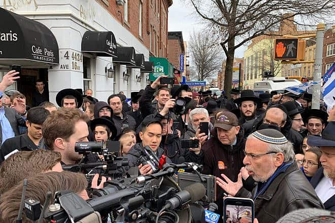 Dov Hikind in front of the kosher Cafe Paris restaurant in the Borough Park section of Brooklyn, N.Y. Credit: Americans Against Antisemitism.
