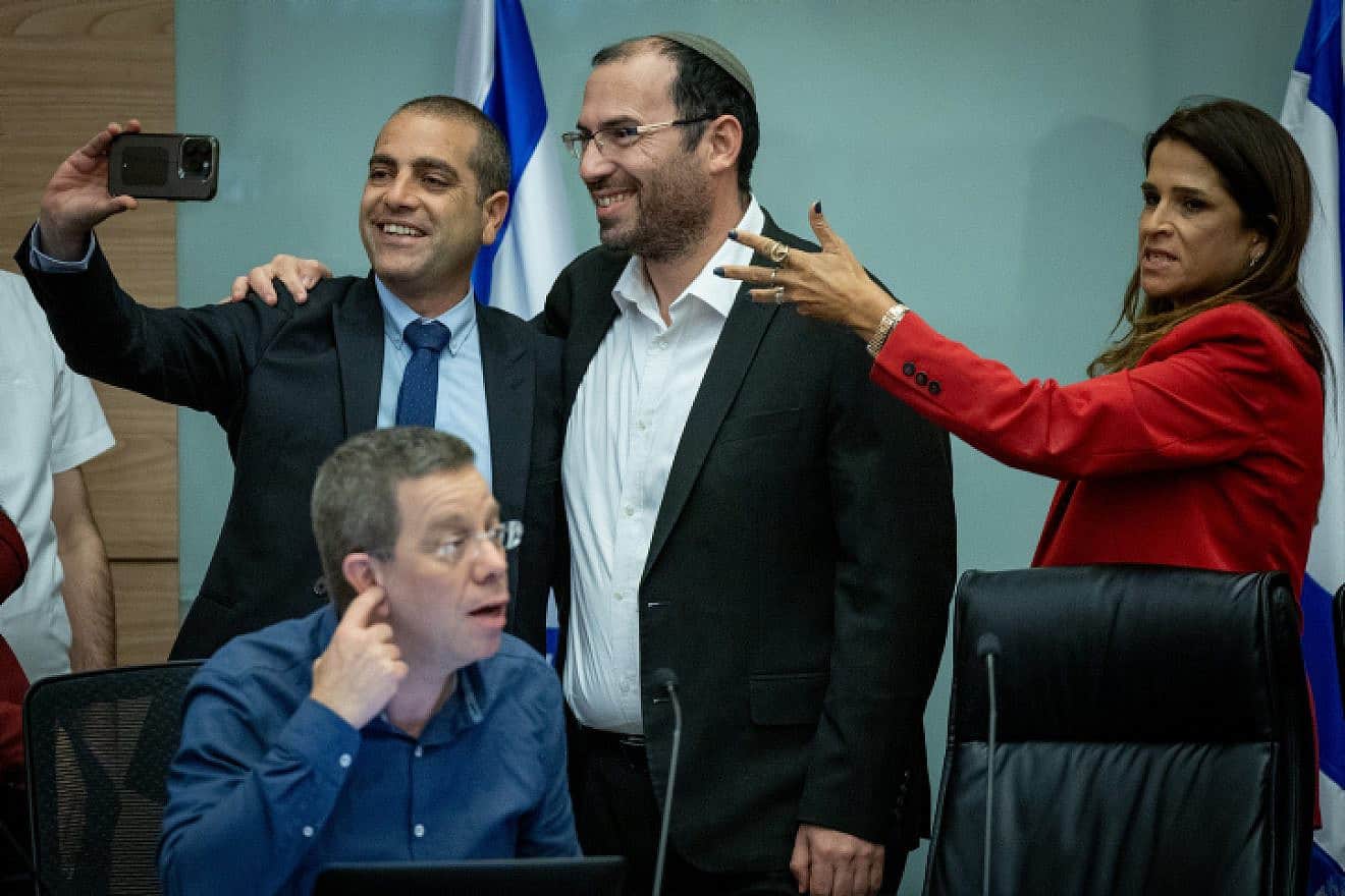 MK Simcha Rothman (center), head of the Constitution, Law and Justice Committee, with MK Ofir Katz (left) after the panel met in Jerusalem, July 19, 2023. Photo by Yonatan Sindel/Flash90.