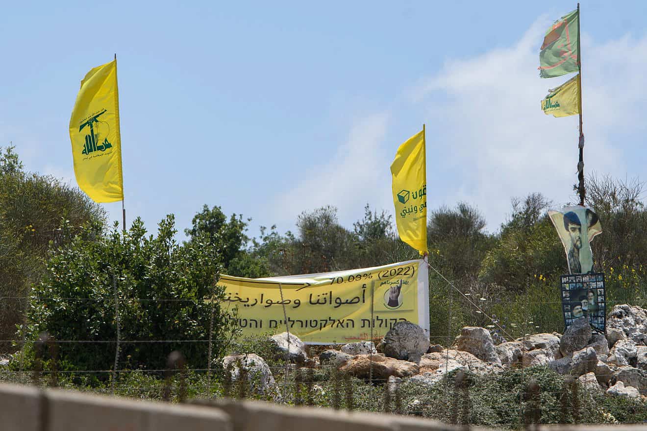 Hezbollah flags just over the border in Lebanon, July 3, 2022. Photo by Ayal Margolin/Flash90.